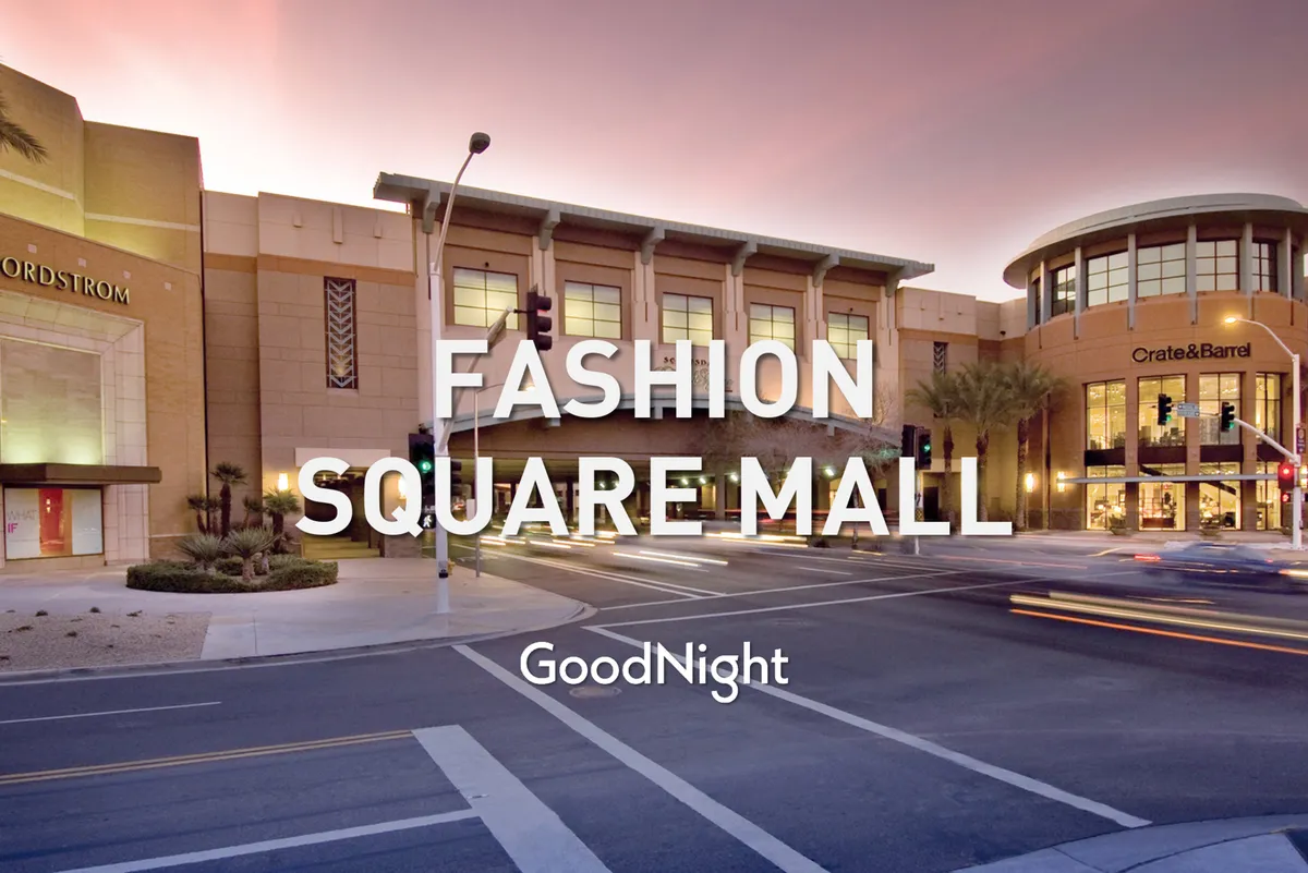 A dynamic exterior view showcasing prominent retail destinations, including Nordstrom and Crate & Barrel, with glowing lights and a lively pedestrian scene. Evening traffic and storefronts hint at a thriving shopping and social hub.