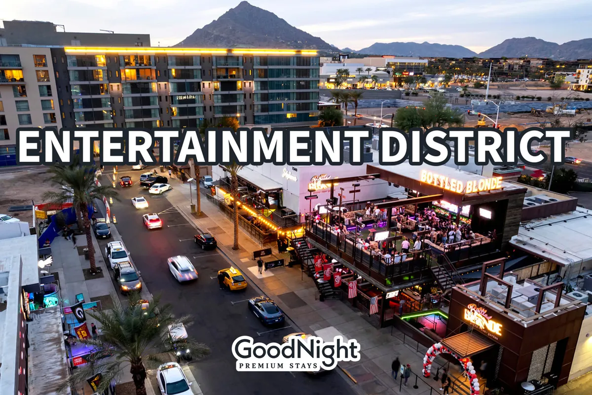 A lively streetscape in Old Town Scottsdale, featuring vibrant entertainment venues, traffic flowing through the bustling streets, visible business signage, and a mountain backdrop. The scene radiates energy and urban excitement, capturing the spirit of local nightlife and social activity.